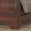 Antoinette dark mahogany close up of curved bed legs design