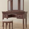 Antoinette dark mahogany dressing table and stool with Mirror resting above