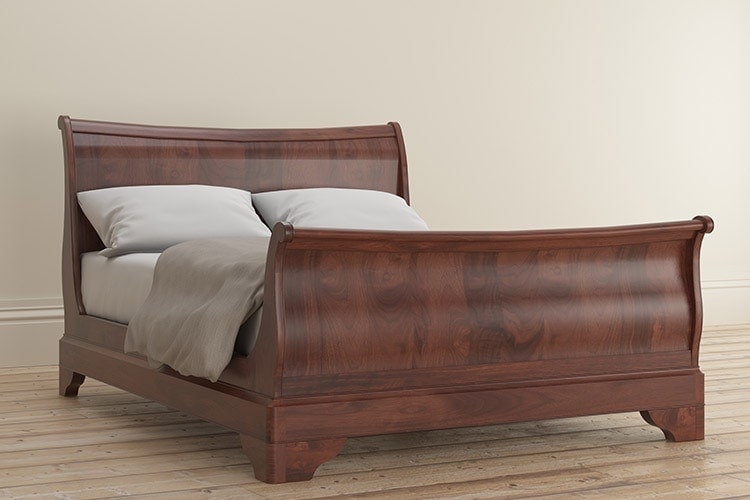 Antoinette dark mahogany bed frame with cream duvet side
